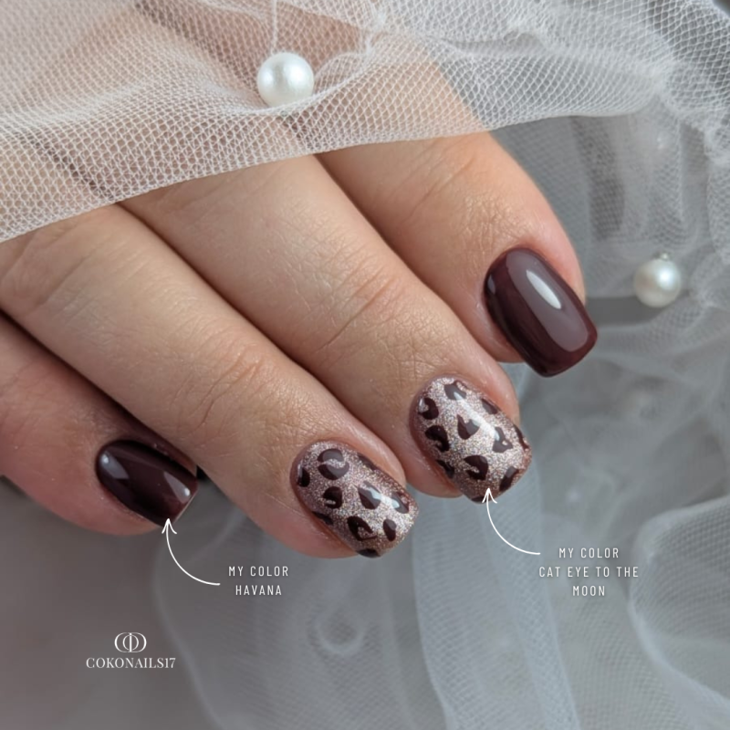 Pose d'ongles ovale avec le vernis semi permanent Cat Eye To The Moon, marron violine clair diamanté